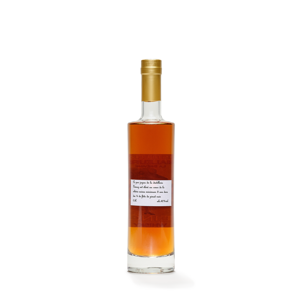 Distillerie La Chaleureuse Geinoz Whisky bottle caramel color back view